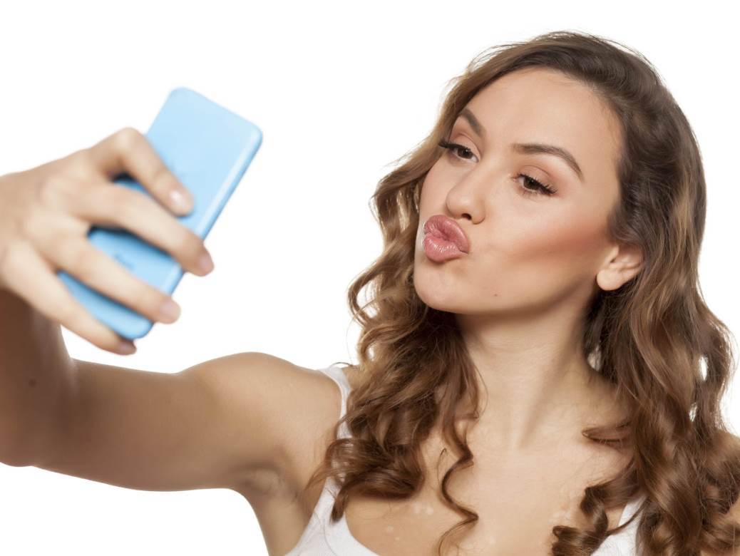 sensual young woman making selfie