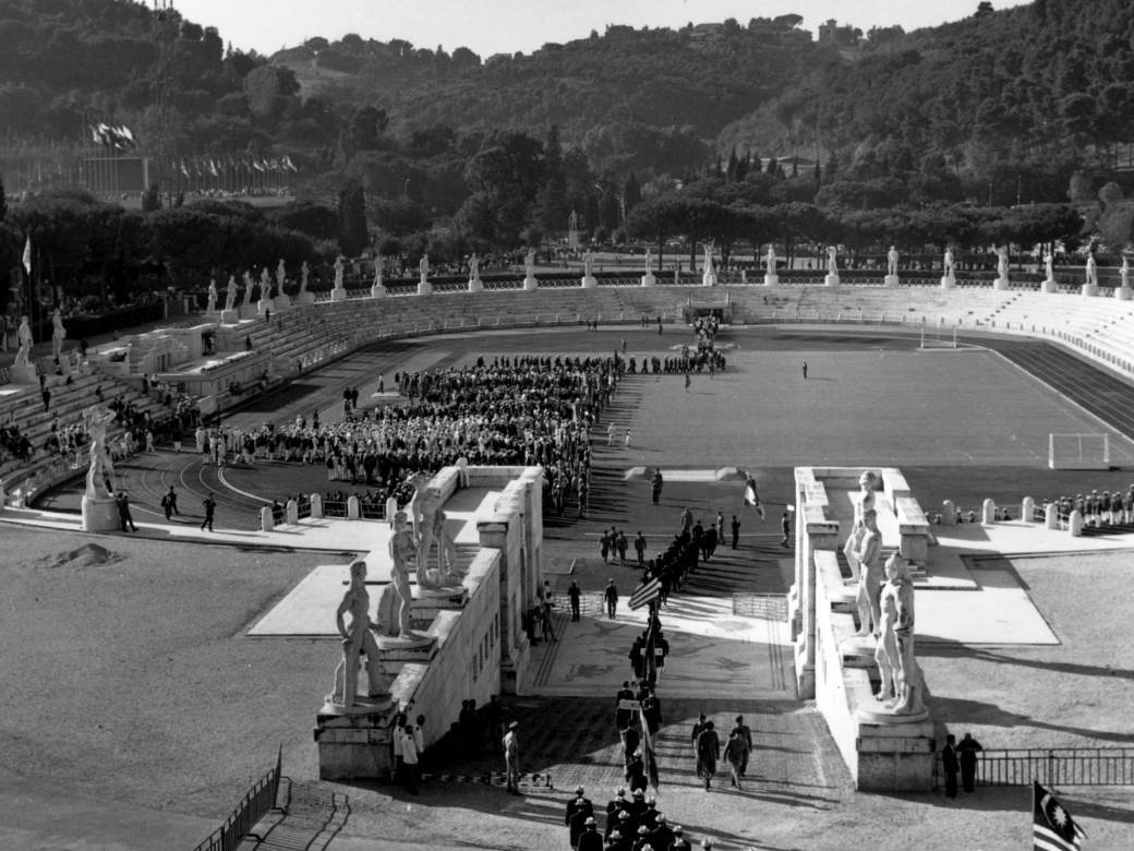 1960: Athletes gathering for the opening ceremony at the Olympics in Rome. (Photo by Central Press/Getty Images)