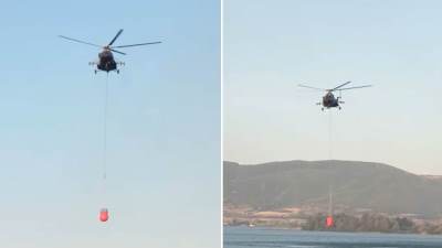  Helikopter uzima vodu iz Dunava i gasi požar kod Golupca 