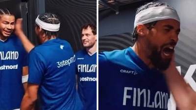  Košarkaši Finske se šamaraju pred početak utakmice 